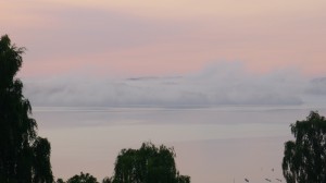 Clouds drifting off the coast at dawn