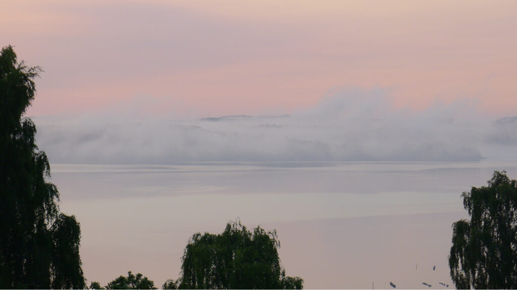 Clouds drifting off the coast at dawn
